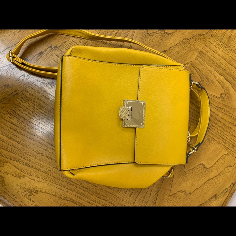 Aldo mustard yellow backpack with good chain